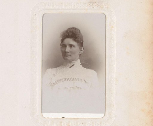 Portrait of a woman in a high-closed white dress