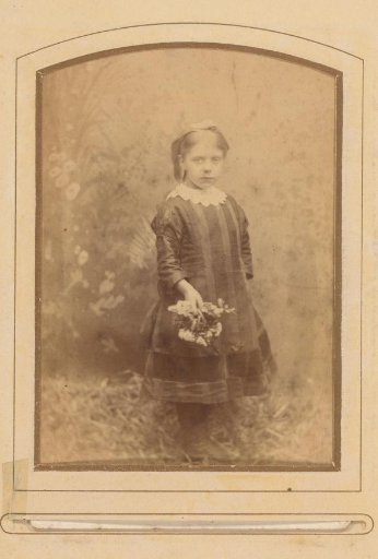 Portrait of a Standing Girl with Flowers in Her Hand