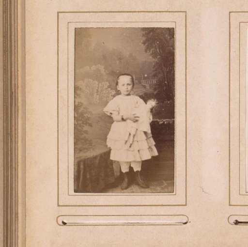 Portrait of a girl with a doll