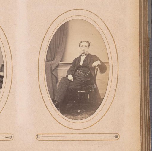 Portrait of a seated man with sideburns