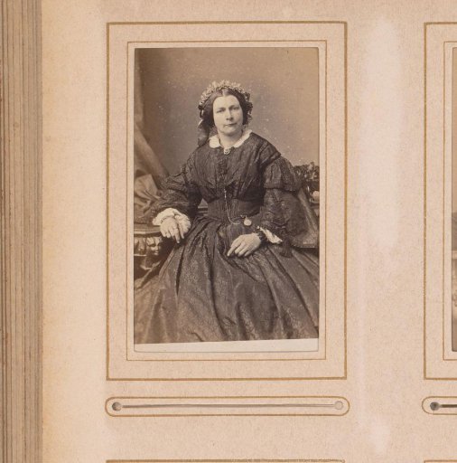 Portrait of a seated woman with a cap