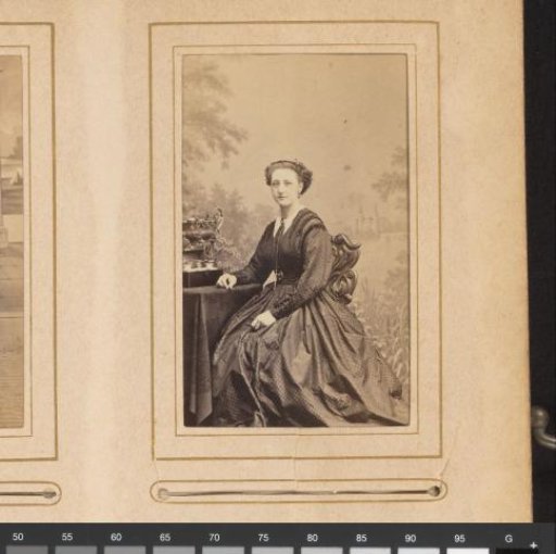 Portrait of a woman seated at a table