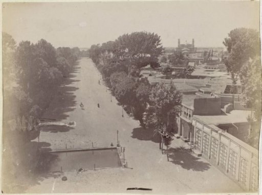 View of Qazvin with a boulevard on the left and the Friday Mosque on the horizon to the right