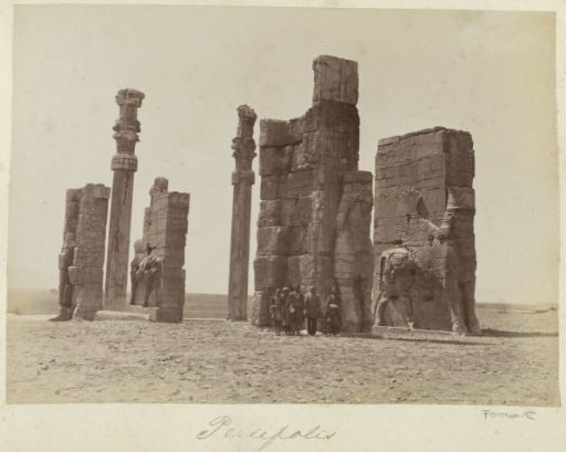 Group of men posing at the Gate of All Nations (Gate of Xerxes) in Persepolis