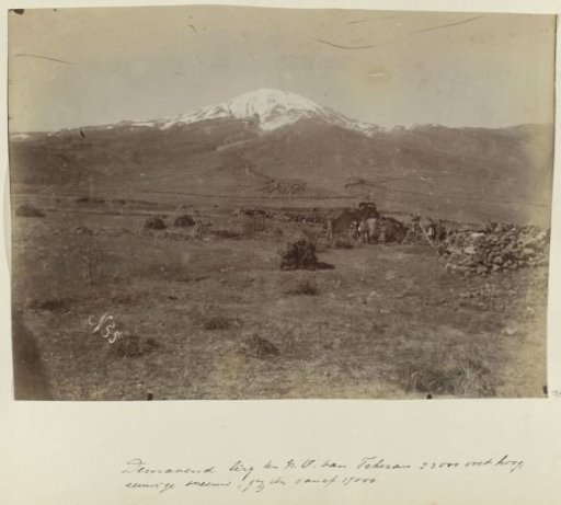 View of Mount Damavand in Persia, with men working with a tripod in the foreground