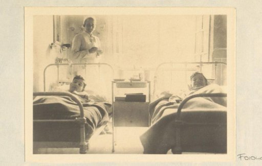 Pupils in bed and a nurse in the hospital of Schule Schloss Salem
