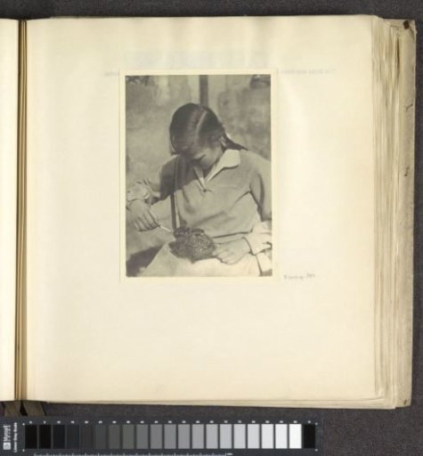 Pupil of Schule Schloss Salem feeding a young rabbit with a pipette