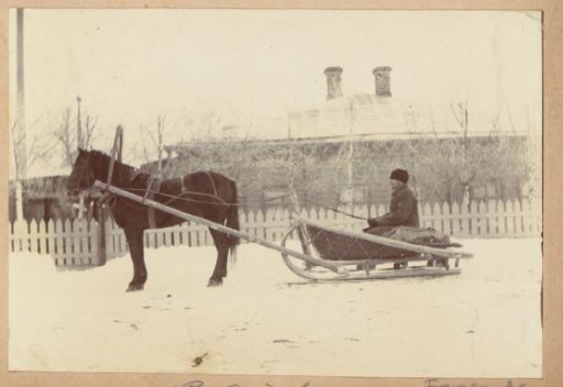 Man on a horse-drawn sleigh in Russia