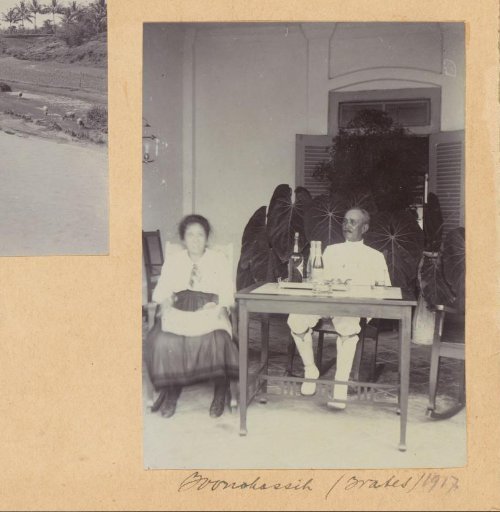 Man and woman on a veranda in the Dutch East Indies