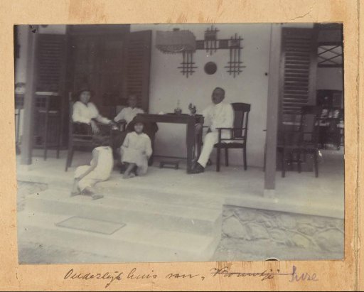 Group on a veranda of a house in the Dutch East Indies