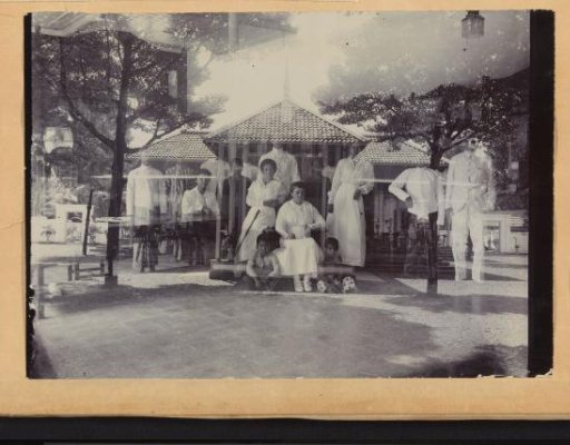 Group portrait of a family in front of a house in the Dutch East Indies