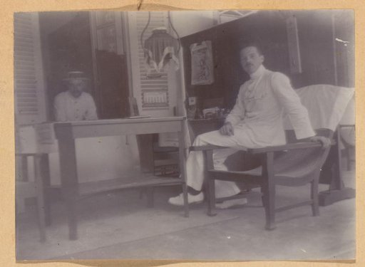 Two men on a veranda, probably in Yogyakarta