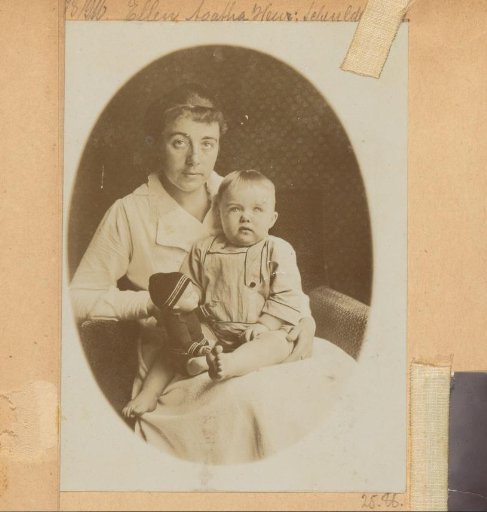 Portrait of a woman with a young child on her lap, possibly in the Netherlands or the Dutch East Indies