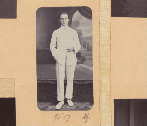 Portrait of a standing man in tropical clothing holding a cigarette in the Dutch East Indies