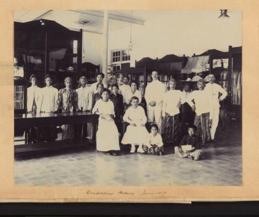 Group portrait of Indonesians and Europeans, presumably in a building of the 'Onderling Belang' Trade Association in the Dutch East Indies