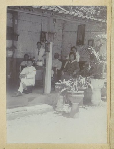 Group portrait of the Van Ede family on a veranda, probably in Yogyakarta