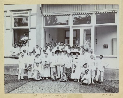 Group portrait of Indonesians and Europeans in front of a building in Purworejo, presumably at a festive occasion