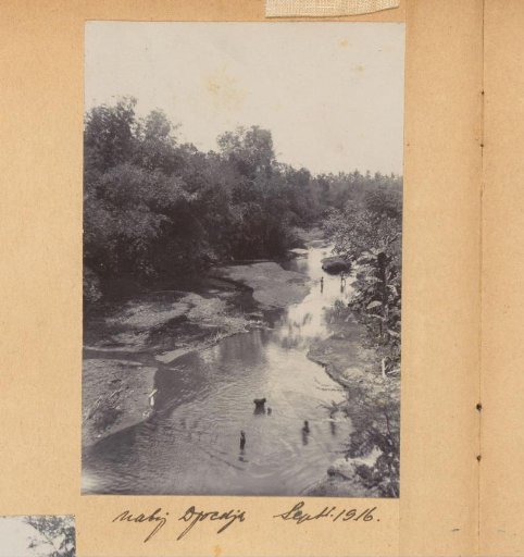 Children swimming in a river near Yogyakarta