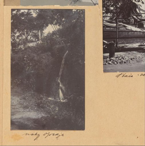 Boy under a waterfall in the Dutch East Indies