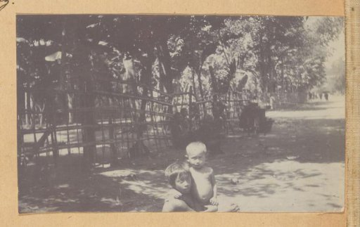 Two small children on the street in the Dutch East Indies