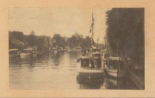 Pleasure boats on a canal, probably in the Netherlands