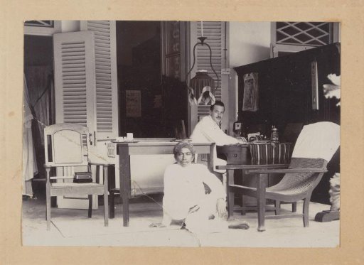 European and Indonesian men on a veranda in the Dutch East Indies
