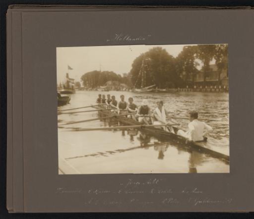 The Young Eight in action on the Amstel, decorated boats in the background