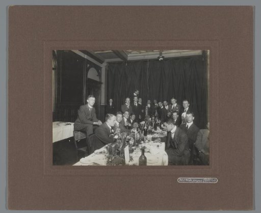 Group portrait of members of rowing club Laga at a dinner in the society of the Delft Student Corps