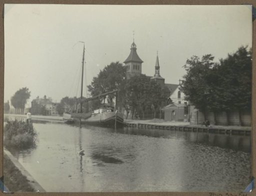 View of the quay and the Roman Catholic St. Peter in Chains Church on the Hartveldseweg in Diemerbrug