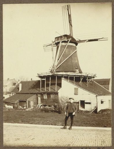 Boy posing in front of the chalk mill De Hoop on the Baarsjesweg in Amsterdam