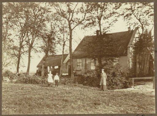 Woman and two children near a cottage, in the vicinity of an Amsterdam stadium