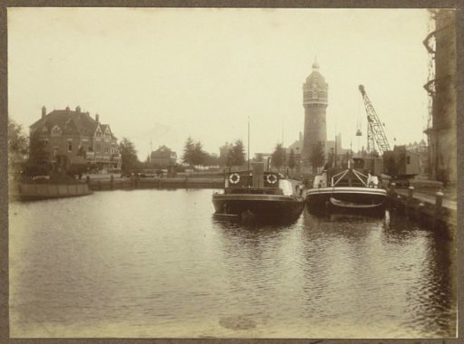 Ships in a harbor near the Southern Gas Factory in Amsterdam
