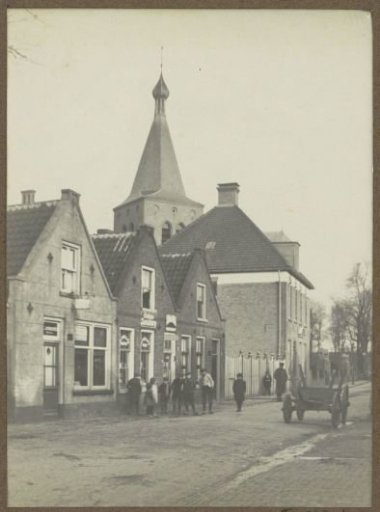Village street with the Church of Saint Pancras in Sloten (NH) in the background