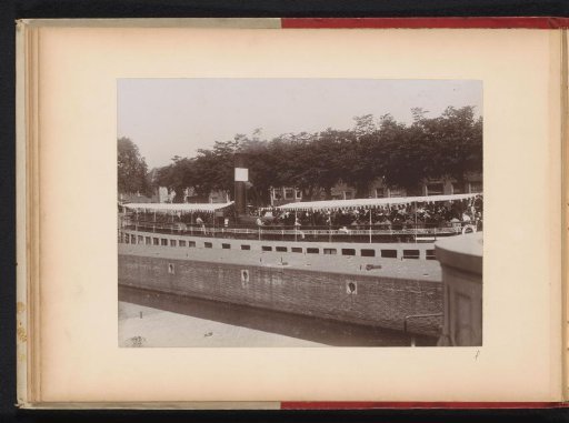 Group of members of the Amsterdam Student Corps on a tour boat in a lock