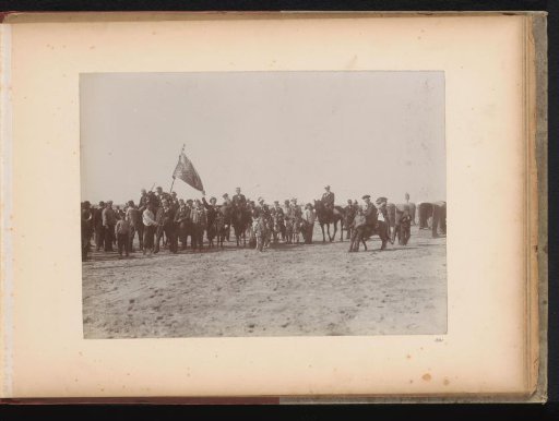 Group portrait of members of the Amsterdam Student Corps on ponies on the beach