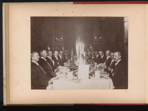 Members of the Amsterdam Student Corps at a set table