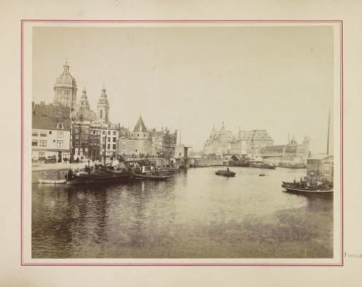 View of the Prins Hendrikkade and the Open Havenfront with the Nicolaaskerk, the Schreierstoren on the left and the Centraal Station of Amsterdam on the right