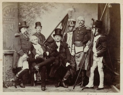 Group portrait of seven unknown men in historical military uniforms and costumes on the occasion of the independence celebrations in Dordrecht