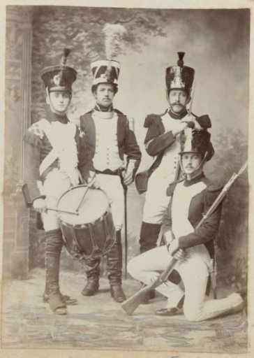 Group portrait of four unknown men in historical military uniforms on the occasion of the independence celebrations in Dordrecht