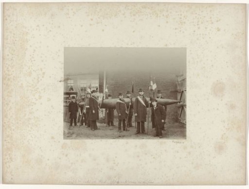 Men with flags at the 6-metre-long Orange cigar for the independence festivities in Dordrecht