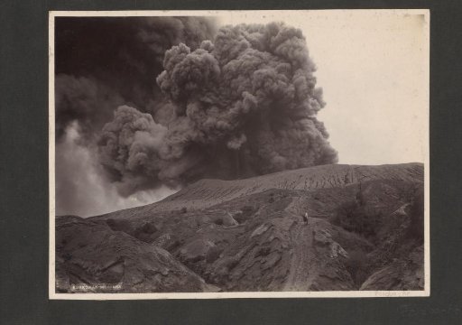 Man with a horse near a smoking volcano in the Dutch East Indies