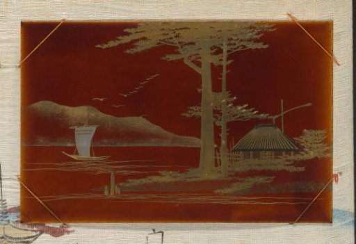 View of a lake with a sailing boat, a building and a water well on the right