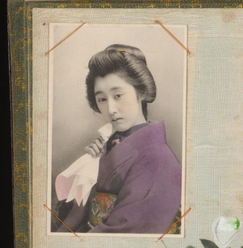 Japanese woman in a purple kimono with a handkerchief in her hand