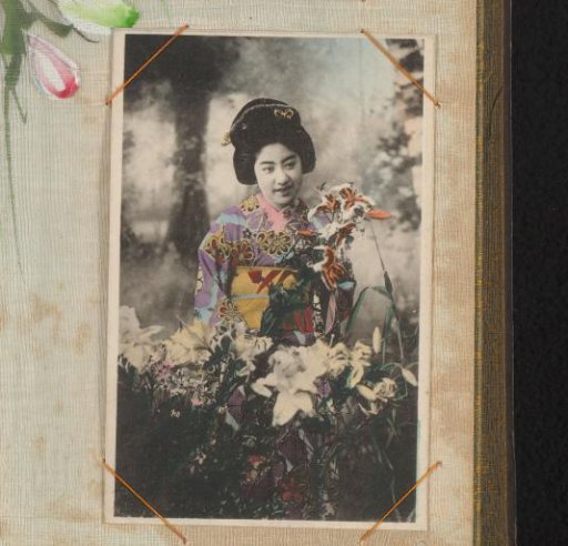 Japanese woman in a colored kimono with flowers in her hand