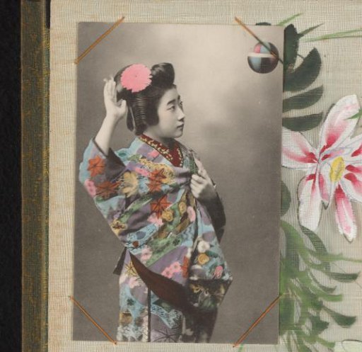 Japanese woman in a colored kimono with a flower in her hair