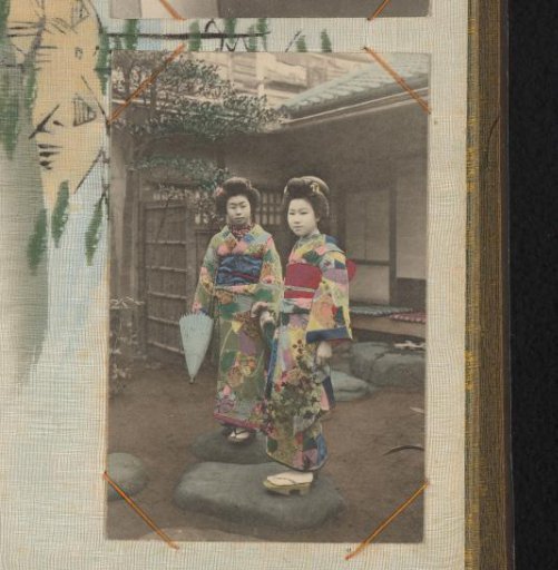 Two Japanese women in colored kimonos and geta, standing in front of a house