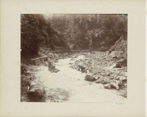 Stream bed with a road in the Dutch East Indies