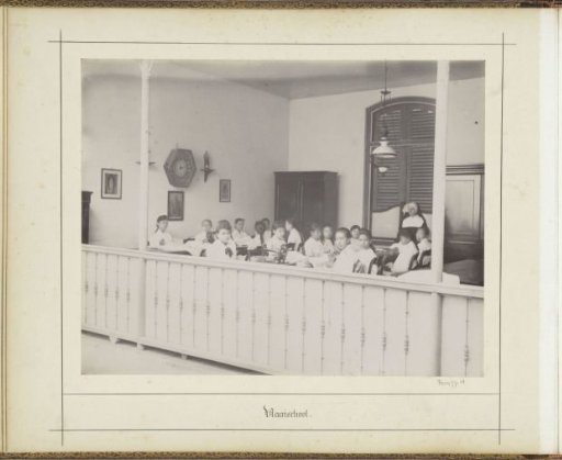 Nun with pupils in a sewing school, probably of the Ursuline Convent in Weltevreden