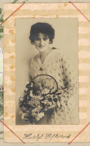 Portrait of a Woman with a Basket of Flowers