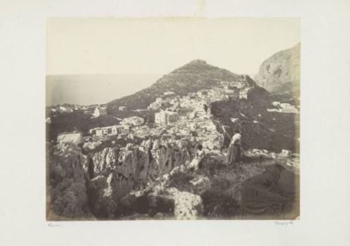 Two women on a rock with a view over a village on Capri